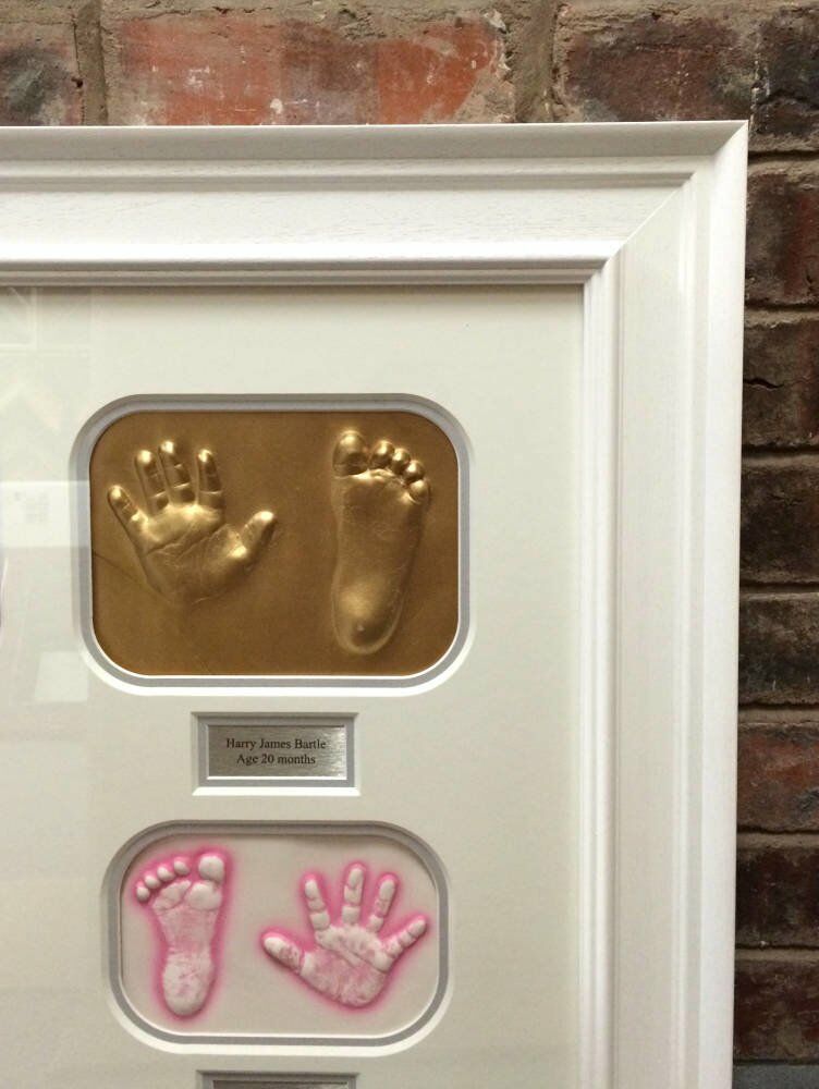473000127 Baby feet and hands framed